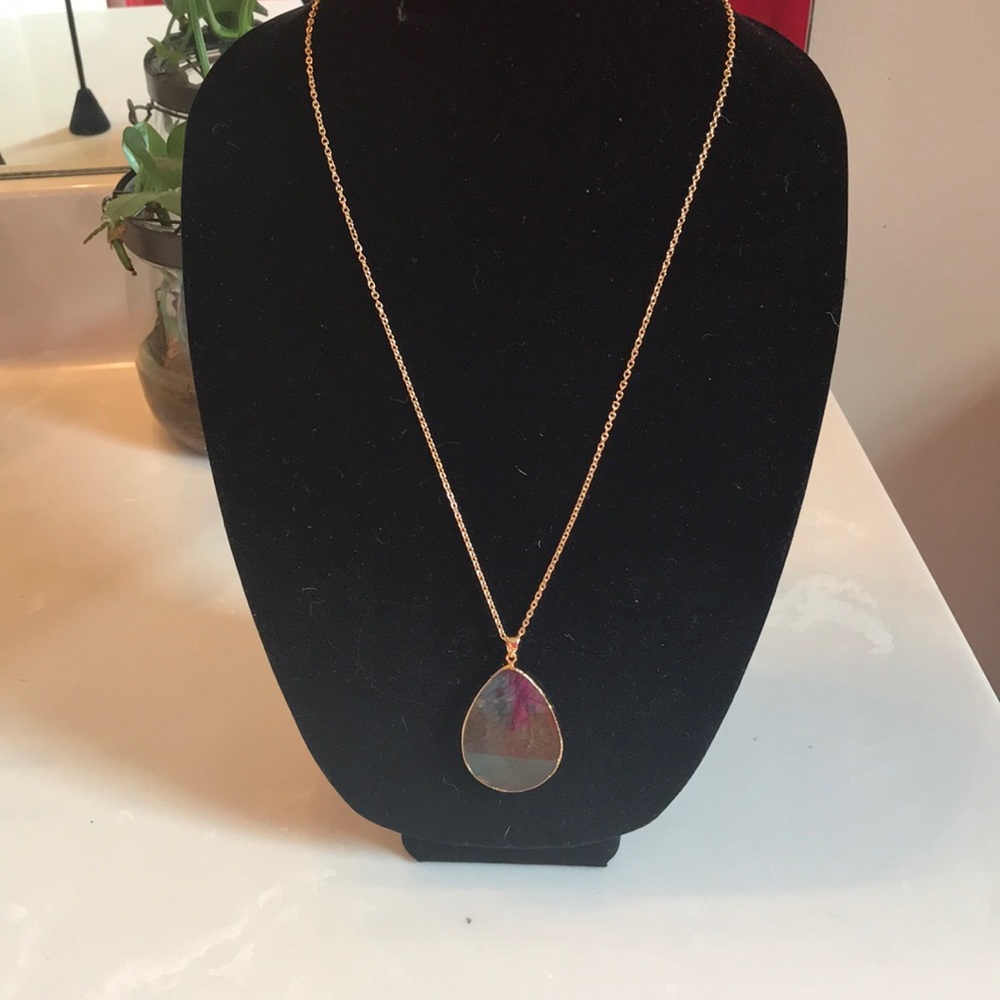 Stunning amulet with gold chain and stone